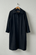 Cappotto nero bouclé su gruccia