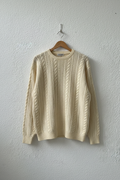 Maglione panna trecce girocollo su gruccia